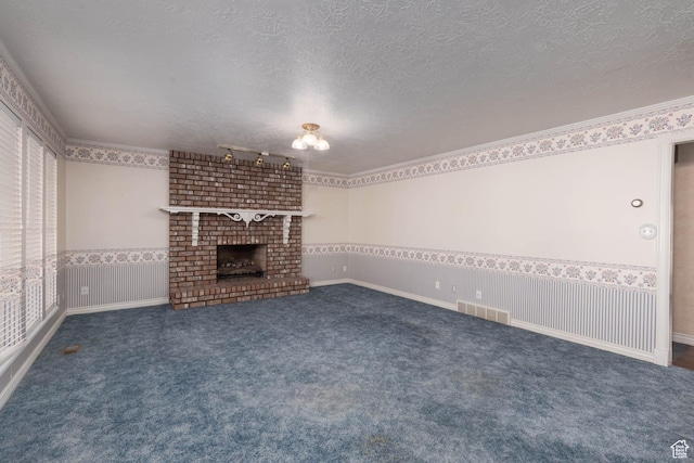 889 Upland Dr, Richfield, UT 84701 - unfurnished living room with visible vents, a textured ceiling, carpet, and a fireplace