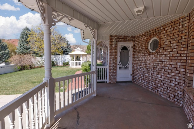 889 Upland Dr, Richfield, UT 84701 - entrance to property with a lawn, a porch, and brick siding