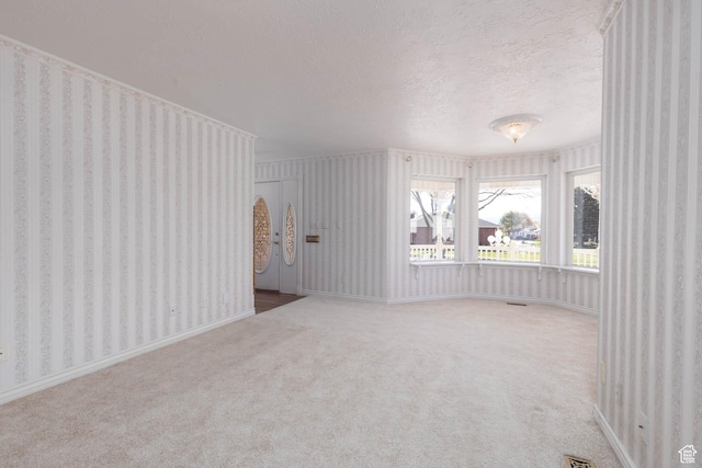 889 Upland Dr, Richfield, UT 84701 - interior space with a textured ceiling, arched walkways, and wallpapered walls