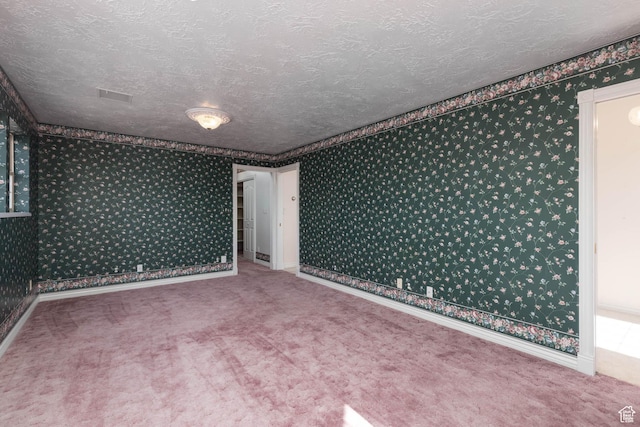 889 Upland Dr, Richfield, UT 84701 - carpeted spare room featuring baseboards, wallpapered walls, and a textured ceiling