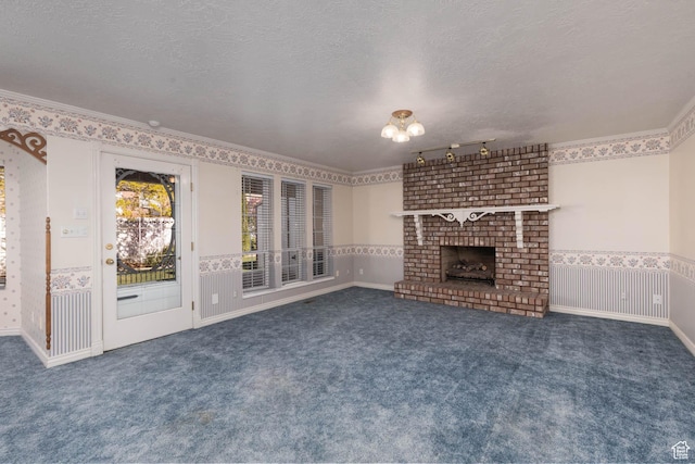 889 Upland Dr, Richfield, UT 84701 - unfurnished living room with ornamental molding, a textured ceiling, carpet, and a brick fireplace
