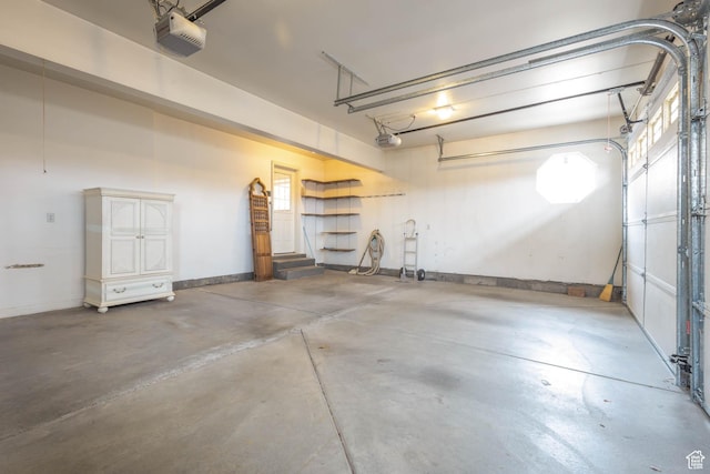 889 Upland Dr, Richfield, UT 84701 - garage with a garage door opener and baseboards