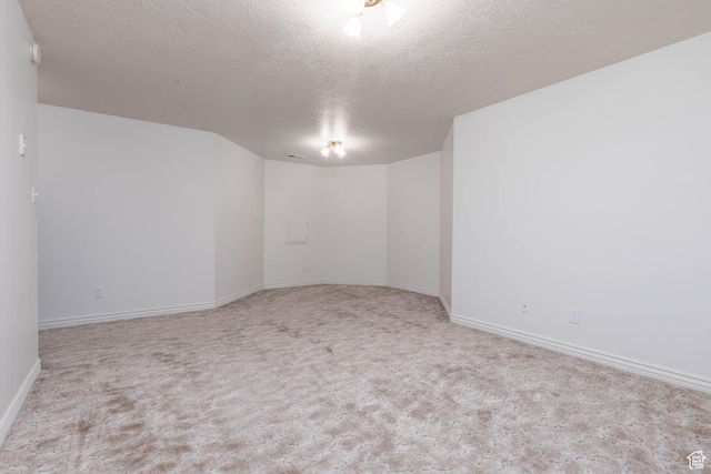 889 Upland Dr, Richfield, UT 84701 - spare room with a textured ceiling, carpet flooring, and baseboards