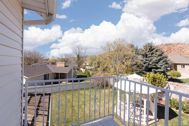 889 Upland Dr, Richfield, UT 84701 - deck featuring fence, a residential view, and a lawn