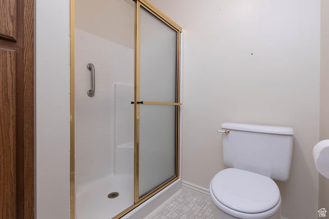 889 Upland Dr, Richfield, UT 84701 - bathroom with toilet, a shower stall, and baseboards