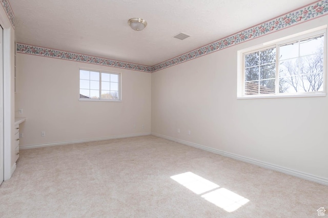889 Upland Dr, Richfield, UT 84701 - spare room featuring baseboards and light carpet