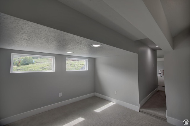728 Loveland Ln, Fish Haven, ID 83287 - below grade area with recessed lighting, a textured ceiling, carpet floors, and baseboards