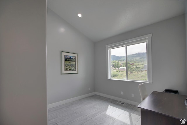 728 Loveland Ln, Fish Haven, ID 83287 - spare room with recessed lighting, vaulted ceiling, a mountain view, baseboards, and visible vents