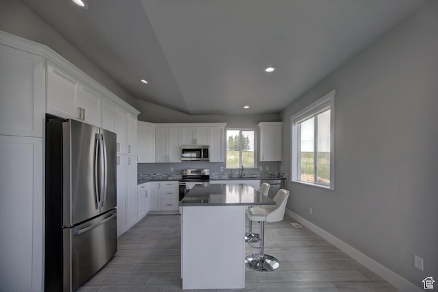 728 Loveland Ln, Fish Haven, ID 83287 - kitchen with a breakfast bar area, recessed lighting, a kitchen island, and stainless steel appliances