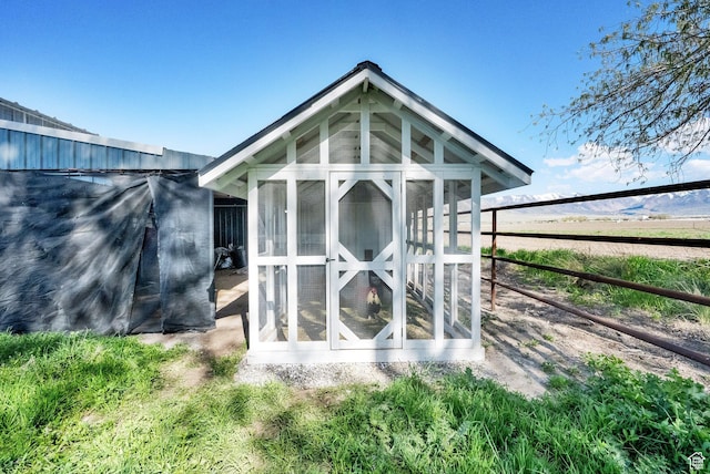 302 Old Farm Rd, Erda, UT 84074 - rear view of property with fence, exterior structure, and an outbuilding