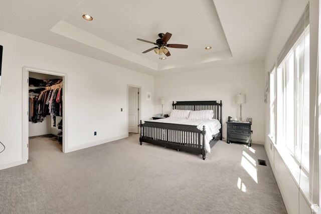 302 Old Farm Rd, Erda, UT 84074 - carpeted bedroom featuring a raised ceiling, visible vents, baseboards, recessed lighting, and a spacious closet
