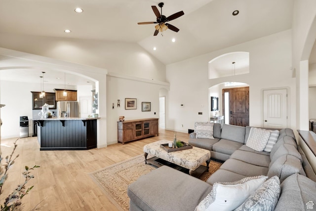 302 Old Farm Rd, Erda, UT 84074 - living area featuring ceiling fan, light wood-style floors, arched walkways, recessed lighting, and high vaulted ceiling