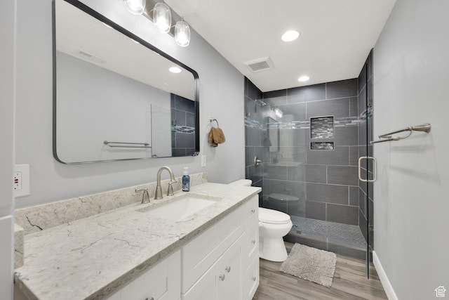 302 Old Farm Rd, Erda, UT 84074 - bathroom featuring a shower stall, visible vents, toilet, wood finished floors, and vanity