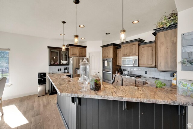 302 Old Farm Rd, Erda, UT 84074 - kitchen with appliances with stainless steel finishes, a peninsula, recessed lighting, and light wood finished floors