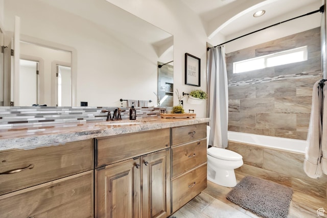 302 Old Farm Rd, Erda, UT 84074 - full bathroom featuring vanity, toilet, and tiled shower / bath combo