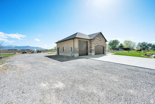 302 Old Farm Rd, Erda, UT 84074 - view of property exterior featuring a mountain view and stone siding
