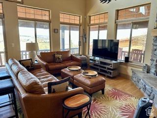 620 W Cisco Run Run, Garden City, UT 84028 - living area featuring a towering ceiling, wood finished floors, and plenty of natural light