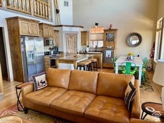 620 W Cisco Run Run, Garden City, UT 84028 - living area featuring light wood-type flooring and a high ceiling