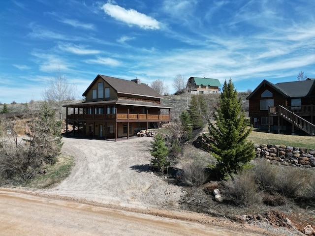 620 W Cisco Run Run, Garden City, UT 84028 - view of front of house featuring a wooden deck and dirt driveway