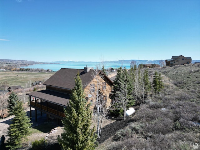 620 W Cisco Run Run, Garden City, UT 84028 - view of side of home with a deck with water view and roof with shingles