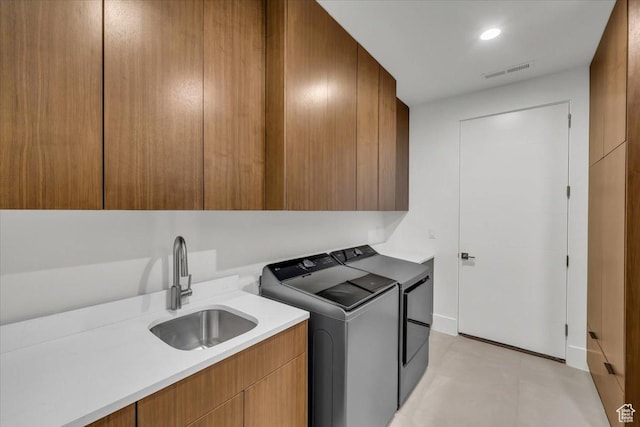 533 S Kwavasa Dr, Ivins, UT 84738 - clothes washing area featuring a sink, washer and dryer, cabinet space, and visible vents