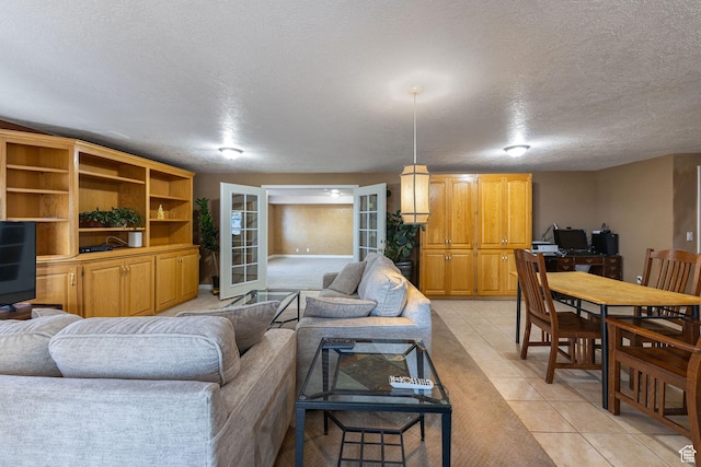 1910 E Canyon Ridge Dr, North Logan, UT 84341 - living area featuring light tile patterned flooring, a textured ceiling, and french doors