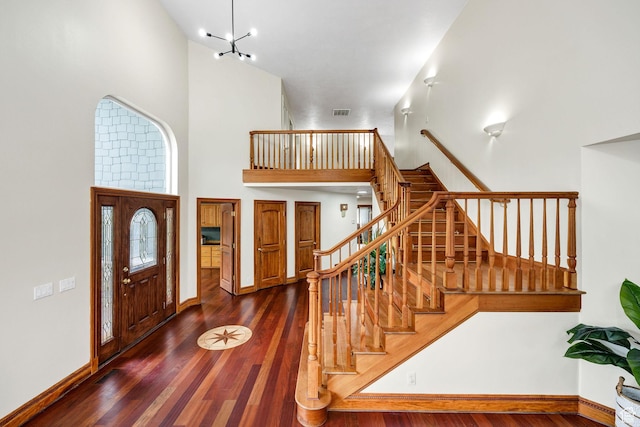 1910 E Canyon Ridge Dr, North Logan, UT 84341 - entrance foyer featuring a high ceiling, stairs, visible vents, baseboards, and wood finished floors