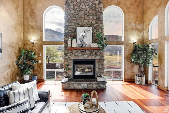 1910 E Canyon Ridge Dr, North Logan, UT 84341 - living room with wood finished floors, a wealth of natural light, and a high ceiling