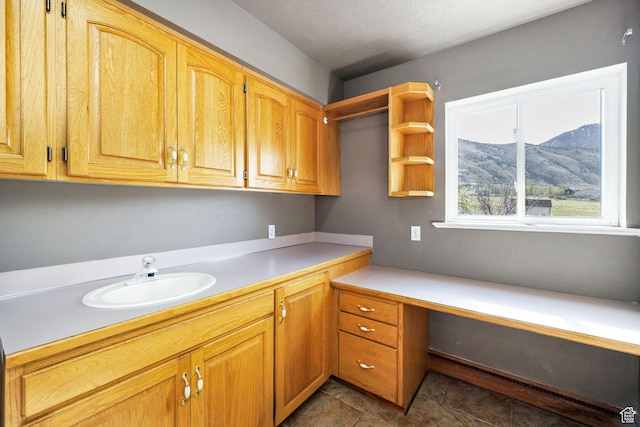 1910 E Canyon Ridge Dr, North Logan, UT 84341 - interior space featuring a mountain view, built in study area, and a sink