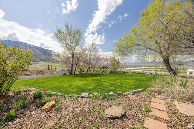 1910 E Canyon Ridge Dr, North Logan, UT 84341 - view of yard featuring fence, a rural view, and a mountain view