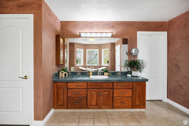 1910 E Canyon Ridge Dr, North Logan, UT 84341 - bathroom featuring tile patterned floors, vanity, and baseboards