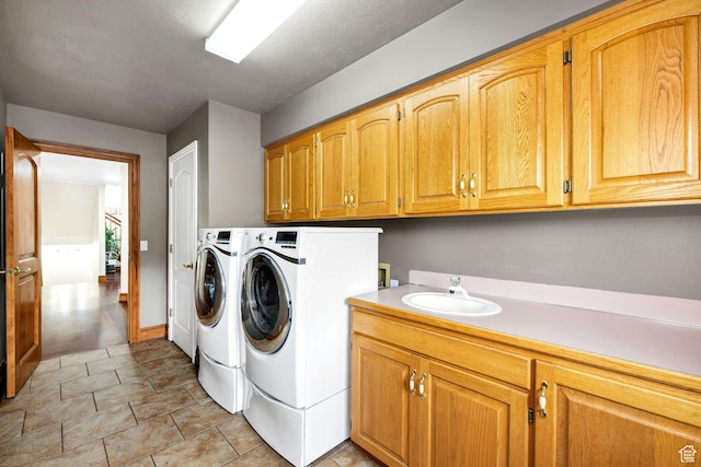 1910 E Canyon Ridge Dr, North Logan, UT 84341 - clothes washing area with independent washer and dryer, cabinet space, and a sink