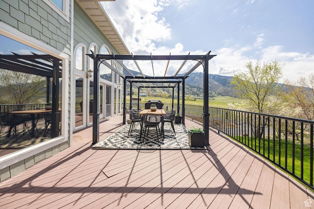 1910 E Canyon Ridge Dr, North Logan, UT 84341 - wooden deck with a mountain view, outdoor dining area, and a pergola