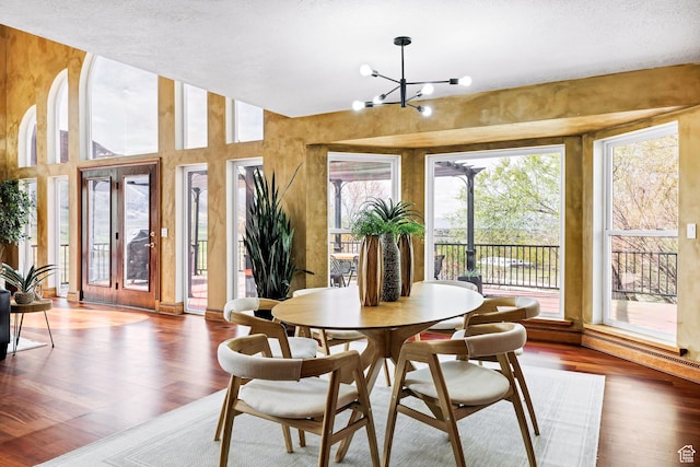 1910 E Canyon Ridge Dr, North Logan, UT 84341 - dining area featuring wood finished floors and an inviting chandelier