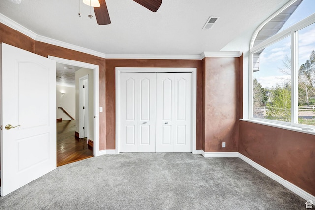 1910 E Canyon Ridge Dr, North Logan, UT 84341 - unfurnished bedroom with carpet flooring, visible vents, baseboards, a closet, and a ceiling fan