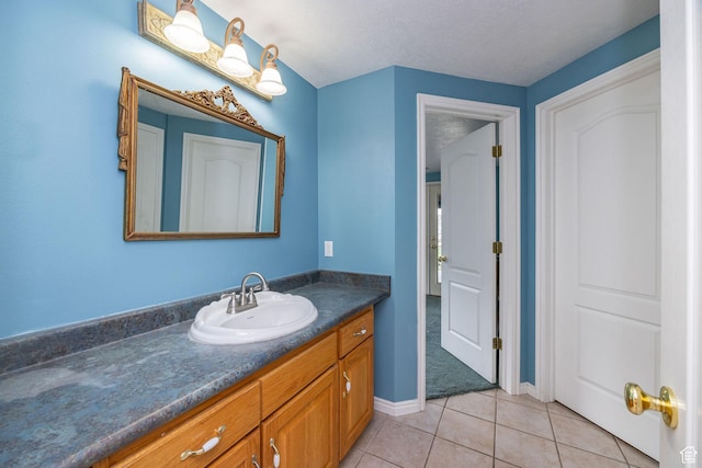 1910 E Canyon Ridge Dr, North Logan, UT 84341 - bathroom with vanity, tile patterned flooring, and baseboards
