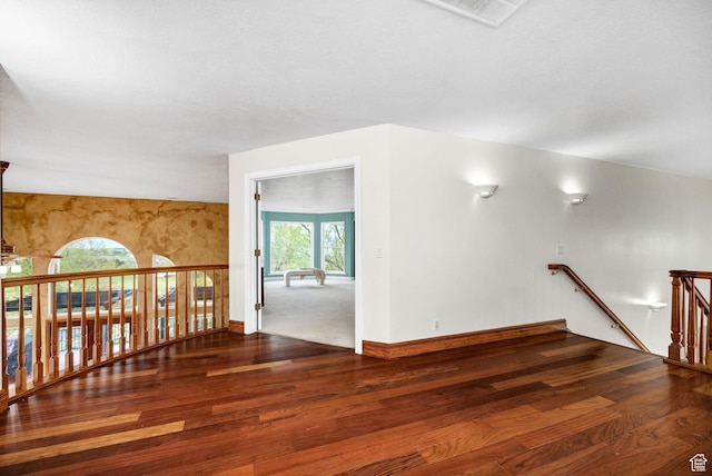 1910 E Canyon Ridge Dr, North Logan, UT 84341 - additional living space with visible vents, wood finished floors, and baseboards