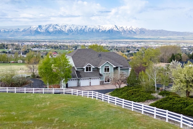 birds eye view of property with a mountain view