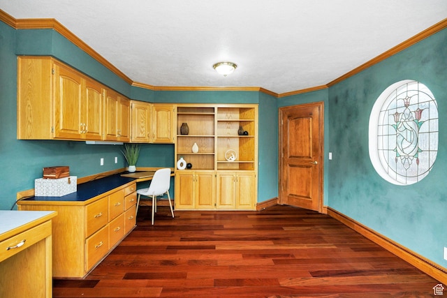 1910 E Canyon Ridge Dr, North Logan, UT 84341 - office featuring built in desk, crown molding, dark wood-style flooring, and baseboards