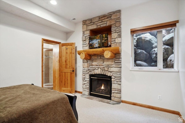 3634 N Huntsman Path Unit C201, Eden, UT 84310 - carpeted bedroom with a stone fireplace, connected bathroom, and baseboards