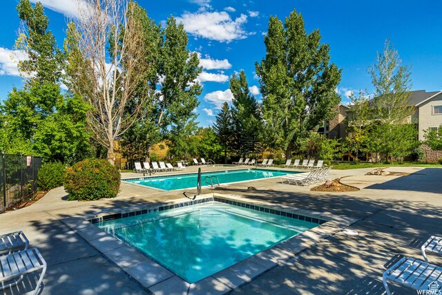 3634 N Huntsman Path Unit C201, Eden, UT 84310 - community pool with fence, a community hot tub, and a patio