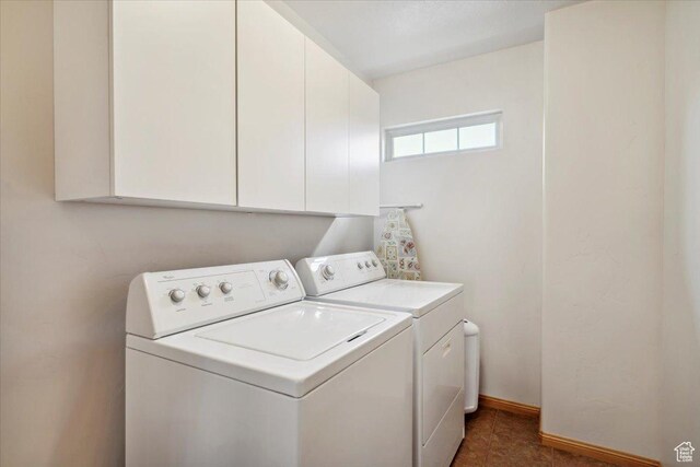 3634 N Huntsman Path Unit C201, Eden, UT 84310 - washroom with baseboards, cabinet space, and independent washer and dryer