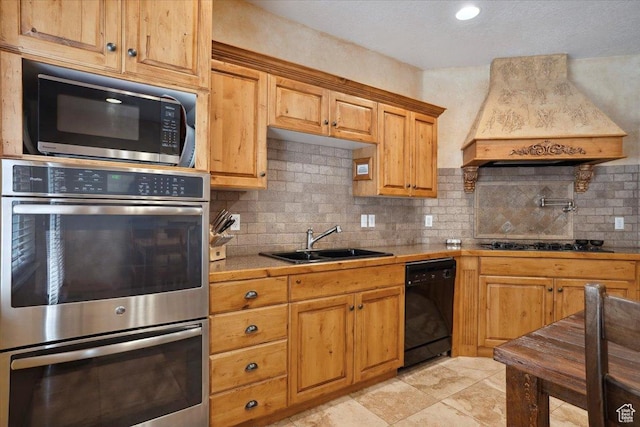 3634 N Huntsman Path Unit C201, Eden, UT 84310 - kitchen with stainless steel double oven, custom exhaust hood, dishwasher, a sink, and gas cooktop