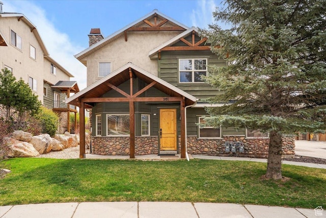 3634 N Huntsman Path Unit C201, Eden, UT 84310 - craftsman-style house with stucco siding, a chimney, a front lawn, and stone siding