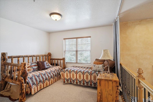 3634 N Huntsman Path Unit C201, Eden, UT 84310 - bedroom with carpet floors and a textured ceiling