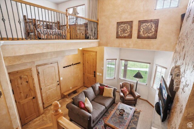 3634 N Huntsman Path Unit C201, Eden, UT 84310 - living area with a towering ceiling, visible vents, and baseboards