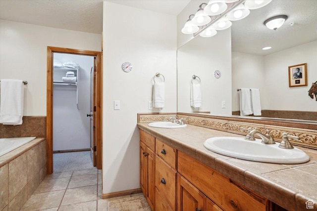 3634 N Huntsman Path Unit C201, Eden, UT 84310 - full bathroom featuring double vanity, baseboards, tile patterned flooring, and a sink