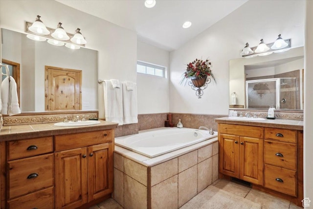 3634 N Huntsman Path Unit C201, Eden, UT 84310 - bathroom with tile patterned floors, two vanities, a shower stall, a sink, and a garden tub