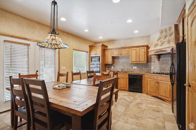 3634 N Huntsman Path Unit C201, Eden, UT 84310 - kitchen featuring recessed lighting, black appliances, backsplash, a sink, and pendant lighting