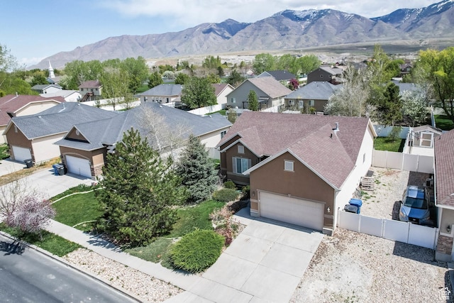 5454 N Windsor Way E, Stansbury Park, UT 84074 - aerial perspective of suburban area featuring mountains
